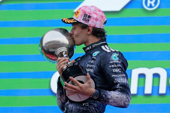 Mercedes driver Kimi Antonelli of Italy reacts on the podium after winning the GP.