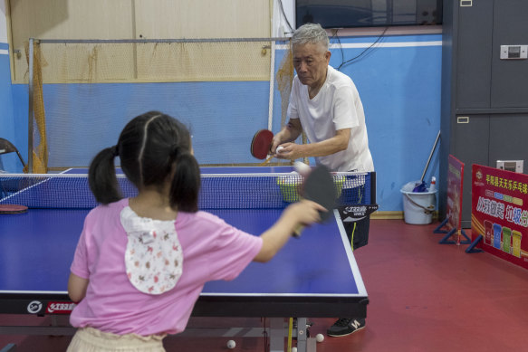 Tang Weidan,72, coaches a young girl at the Tiantianle Table Tennis Club in Wenzhou, where Jian Fang Lay played on a home visit in 2019.
