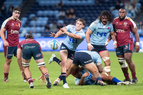 Teddy Wilson passing for the Waratahs against Queensland in 2024.