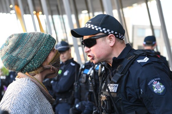 Environmental protesters clash with Police outside the Melbourne Exhibition and Convention Centre on Tuesday as they attempted to disrupt an international mining conference.