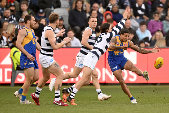 Tim Kelly gets a kick away for West Coast.