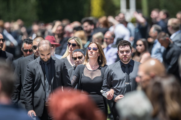 Celeste Manno's mother, Aggie DiMauro, brother Alessandro and boyfriend, Chris Ridsdale (right), leave the service in Whittlesea.