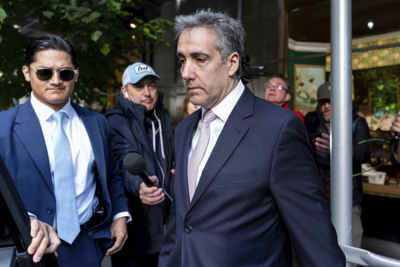 Michael Cohen leaves his apartment building on his way to Manhattan criminal court earlier this month.