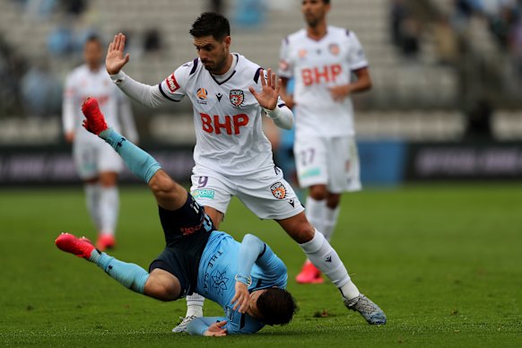 Perth Glory's Bruno Fornaroli stands over Sydney FC's Kosta Barbarouses in their clash at Netstrata Jubilee Stadium on March 14 - one of the final matches of the A-League before COVID-19 forced it into recess.