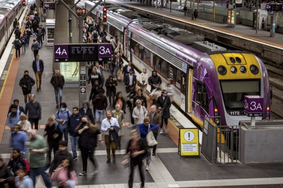 V/Line commuters on a platform at Southern Cross Station.