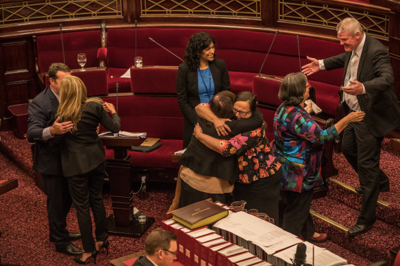 Members of the Victorian upper house celebrate after the 29-hour sitting that passed the Voluntary Assisted Dying Bill.