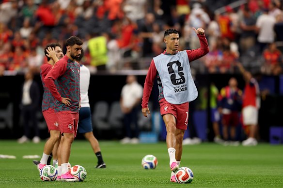 Cristiano Ronaldo takes to the turf in Texas to warm up. 