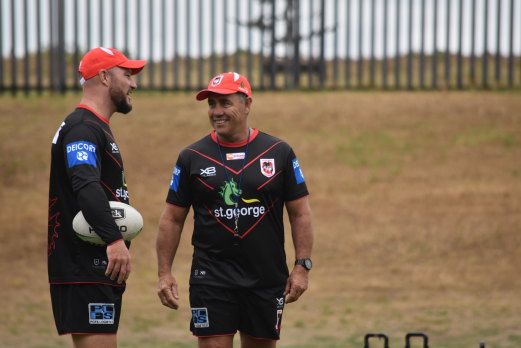 Shane Flanagan chats with fellow Dragons assistant Dean Young.