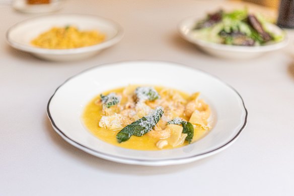 The  scarpinocc (front), with the mafaldine (back left) and green salad.