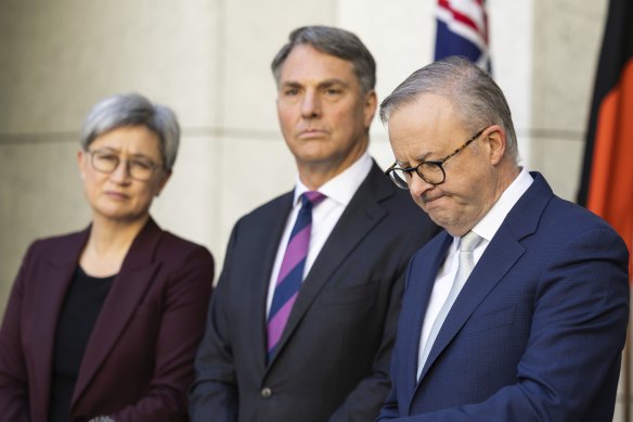 Defence Minister Richard Marles (centre, with Foreign Minister Penny Wong and Prime Minister Anthony Albanese) says Australia will back Ukraine until it resolves its conflict with Russia.