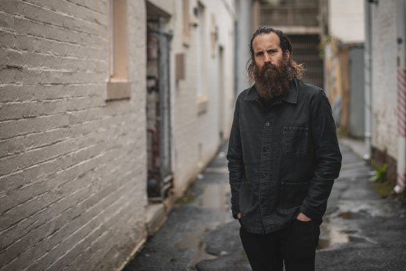 Thomas M. Wright in a laneway in Collingwood, near where he grew up and where he launched his Black Lung theatre company before seguing into film.