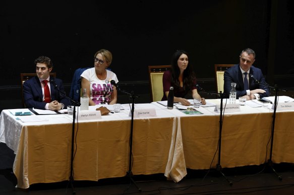 Candidates Martyn Abbott (Labor) Zoe Daniel (Independent) Alana Galli-McRostie (Greens) and Tim Wilson (Liberal) on stage at Brighton Town Hall on Thursday evening.