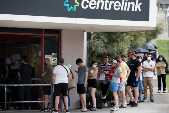 Australians queue outside Centrelink in March as the crisis took hold.