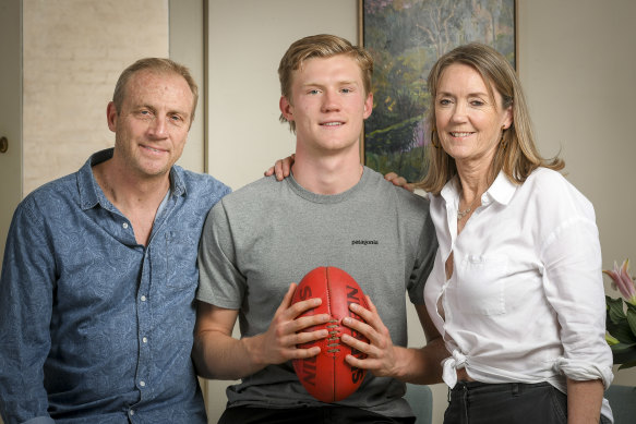 Fischer McAsey with his parents Chris and Gina.