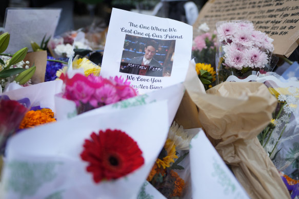A makeshift memorial for Matthew Perry is seen outside his home .