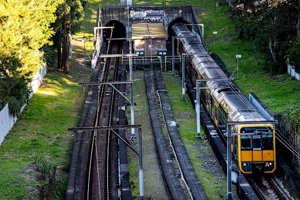 Trains pass the incomplete Woollahra Railway Station on Friday.