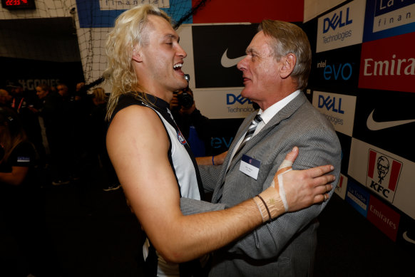 Darcy Moore with father Peter after Collingwood’s preliminary final win.