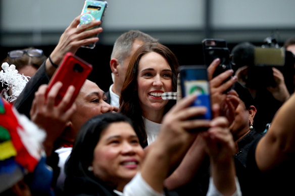 New Zealand Prime Minister Jacinda Ardern poses for photos in Auckland on Friday.