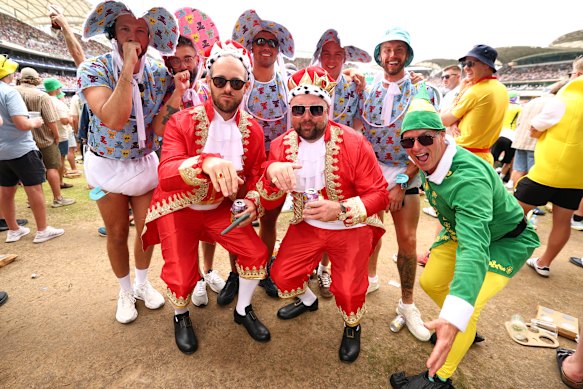 Spectators pose for a picture during day three of the Third Test. 