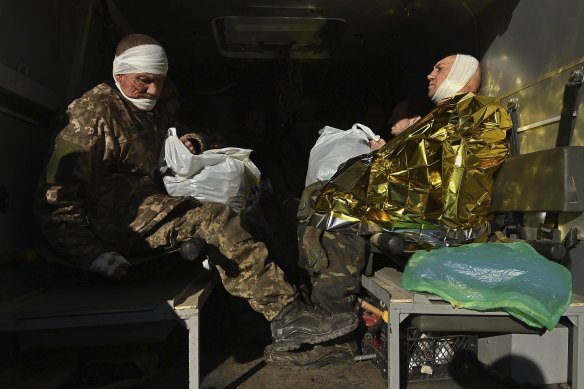 At a medical stabilisation point in Bakhmut, wounded Ukrainian soldiers wait to be transferred to a nearby hospital.