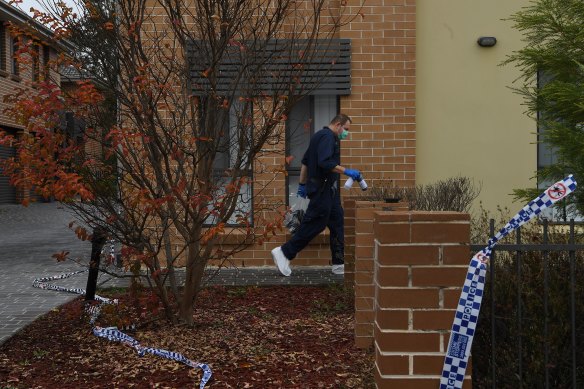 A forensic officer at a home in Quakers Hill where a woman was fatally stabbed on Wednesday night.
