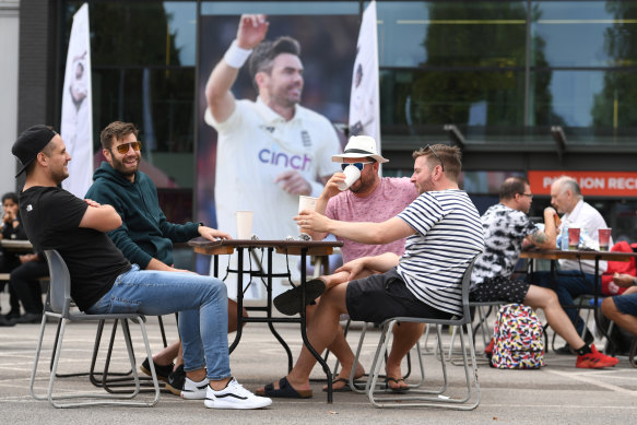 Fans pass the time after the fifth and final Test between England and India was cancelled last minute. 