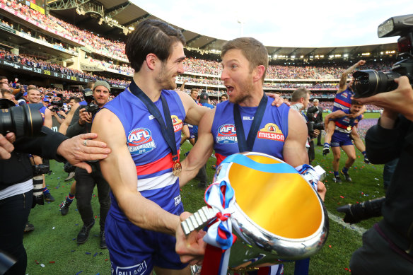 Easton Wood (left) and Matthew Boyd celebrate the Western Bulldogs’ fairytale 2016 premiership, from seventh place.