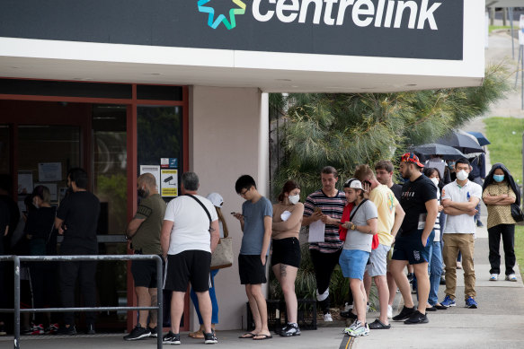 People queue up at a Centrelink office in Sydney in March 2020.