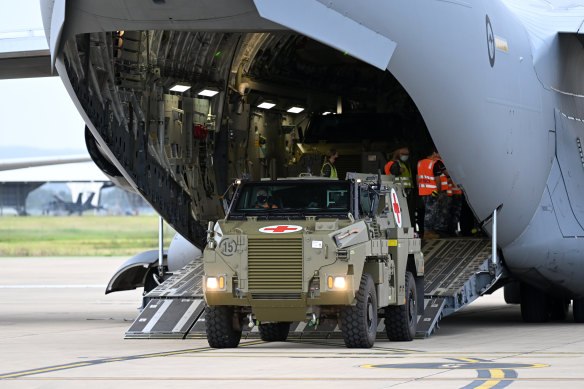 An Australian-made Bushmaster armoured vehicle being loaded o<em></em>nto a RAAF cargo plane heading to Ukraine.