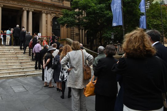 People arrive at Sydney’s Town Hall for the memorial of Jack Mundey on Wednesday.