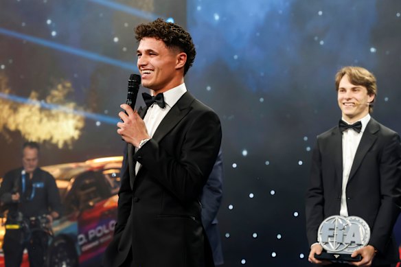 Oscar Piastri (right) watches as praise is heaped on his McLaren teammate  Lando Norris at the Federation Internationale de l’Automobile awards in Tashkent, Uzbekistan, last last year.