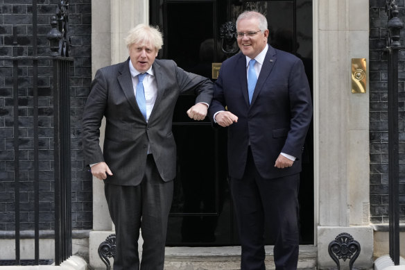 Britain’s Prime Minister Boris Johnson greets Australia’s Prime Minister Scott Morrison.