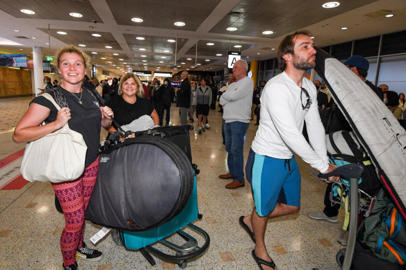 Cathy and Mickey McCallum arrive at Sydney airport on a flight from Denpasar, Bali, on Thursday morning. 