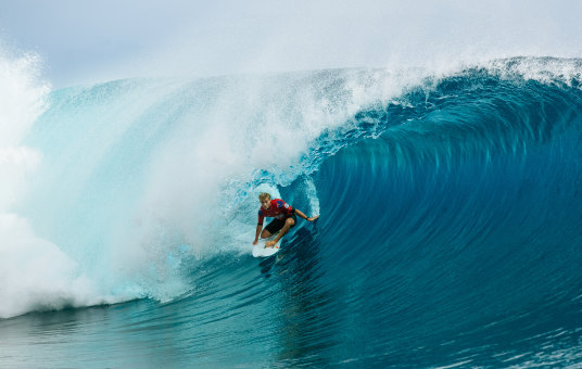 Jack Robinson tucks into a heaving Teahupo’o barrel during the 2022 Tahiti Pro.
