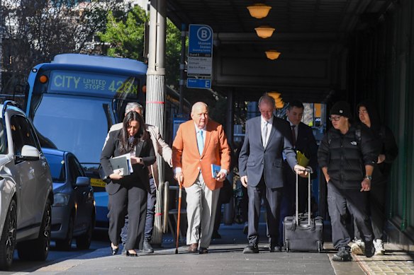 Alan Jones and his legal team arrive at the Local Court on day eight of his trial.