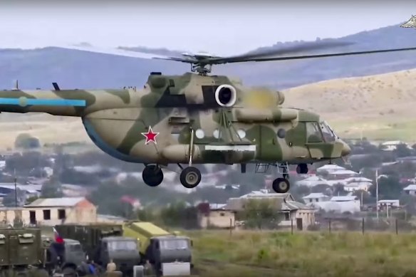A Russian peacekeepers’s military helicopter transports a wounded person from a field hospital in Nagorno-Karabakh to the Armenian side on Tuesday.