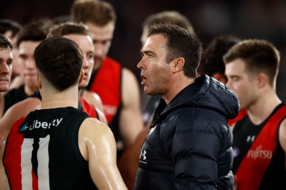 Bombers coach Brad Scott addresses his players.