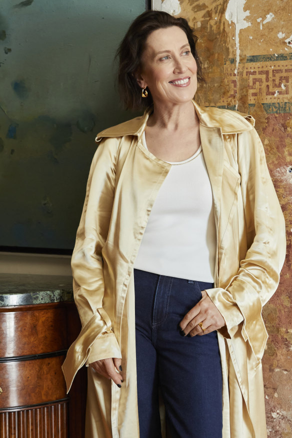 Victoria Beckham trench coat, Perri Cutten singlet, AG jeans, Oroton jewellery.  