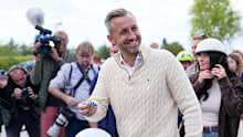 Ulrich Siegmund, top candidate for the “Alternative for Germany” (AfD) party holds his motorcycle keys in party colors after voting at a polling station during the Saxony-Anhalt state elections.