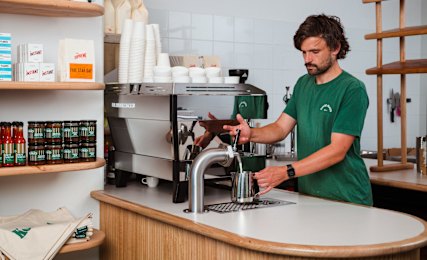 Good Ways Deli barista Tom demonstrates the Udder Way milk keg system.