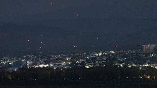 Streaks of light illuminate the sky as India accused Pakistan of violating a ceasefire deal made hours earlier.