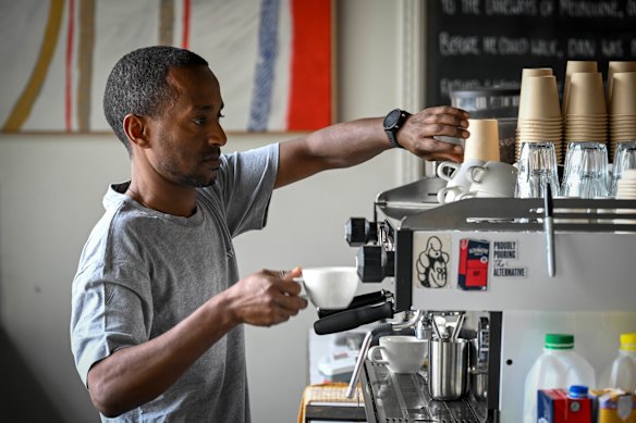 Owner Dan Seyoum makes coffee at Ageyo Coffee.