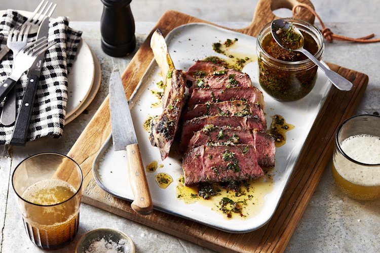 Forget the fast flip. Cook a thick rib-eye slowly and serve it with a punchy chimichurri.