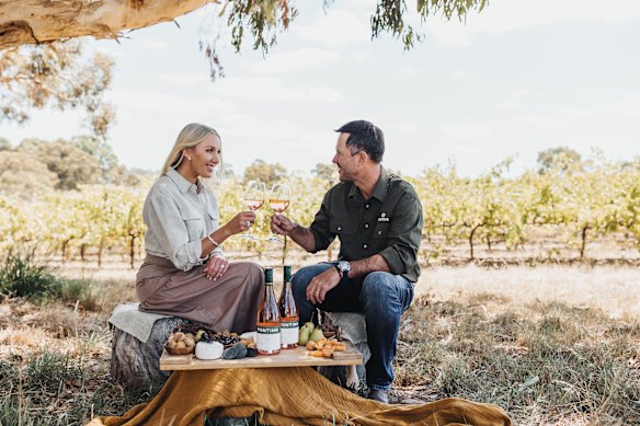 Rianna and Ricky Ponting enjoy a wine in the countryside.