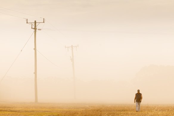 Wild weather with strong winds whips up dust from bare paddocks near Cressy. Farmer Scott Stewart deals with dust as best he can.