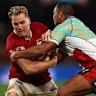 MELBOURNE, AUSTRALIA - JULY 22: Duhan van der Merwe of the British and Irish Lions (L) is tackled by Kurtley Beale of the First Nations & Pasifika during the tour match between First Nations & Pasifika v British & Irish Lions at Marvel Stadium on July 22, 2025 in Melbourne, Australia. (Photo by Graham Denholm/Getty Images)