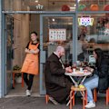 Joris Zhao (standing) opened the shop with her retired parents.