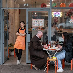 Joris Zhao (standing) opened the shop with her retired parents.