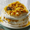 Pavlova stack with passionfruit and mango.