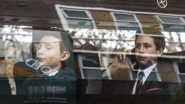 Some students leave Waverley College on private buses.